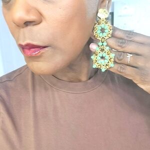 Earing long green, yellow for party times.